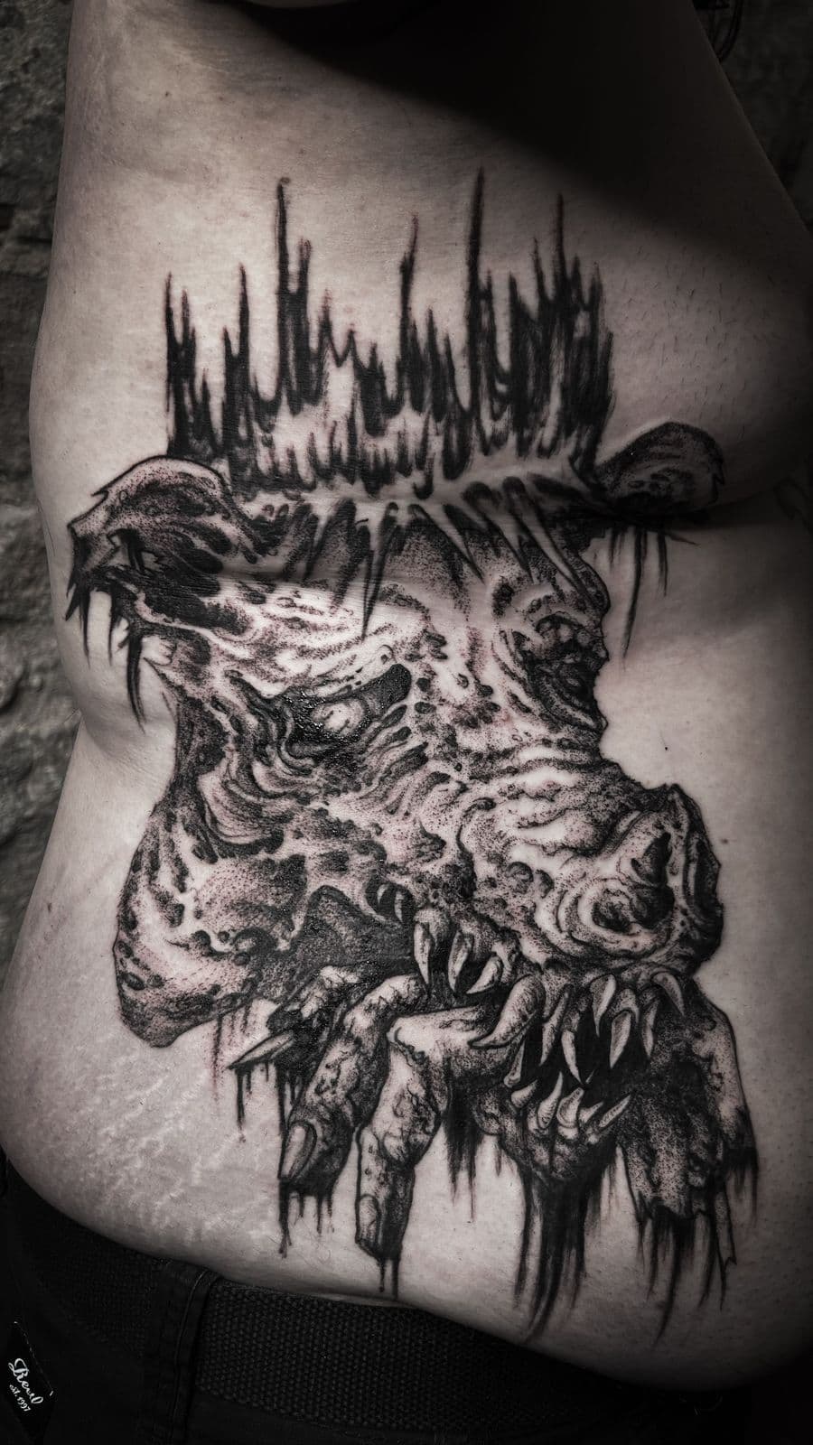 Dark beast with dripping elements on ribs