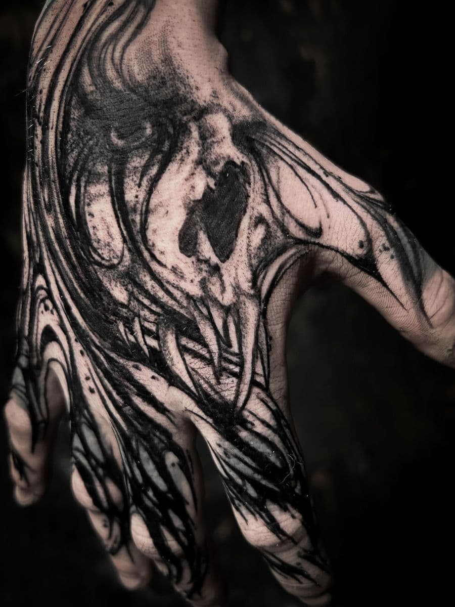 Dark skull hand tattoo - Close-up