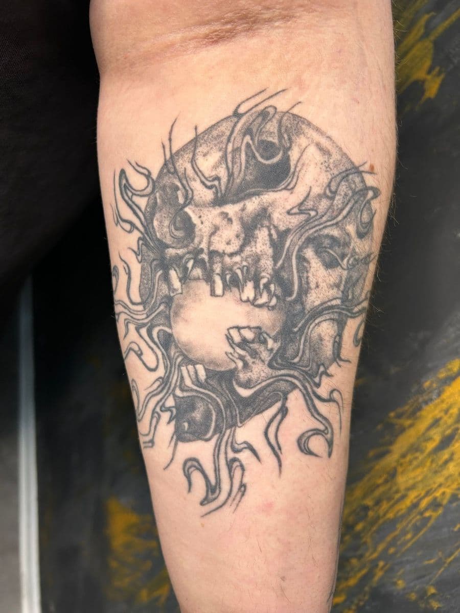 Skull with flames on forearm - Healed